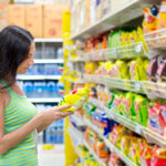 Woman Looking at Salty Snacks